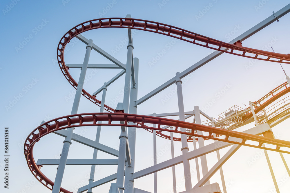 tracks of Roller coaster against blue sky, Perspective Concept
