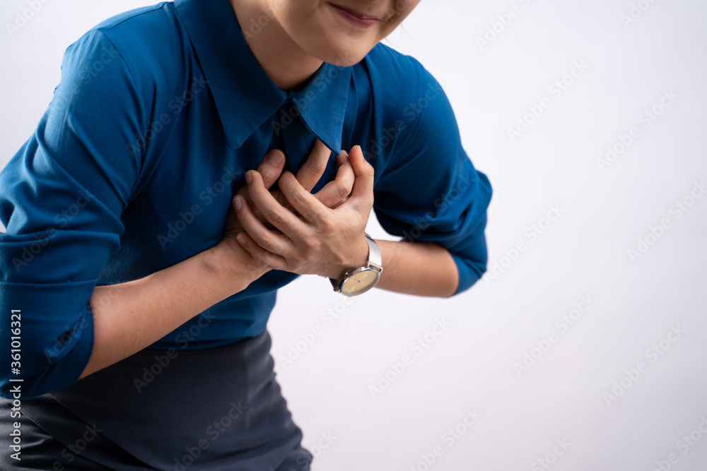 Fototapeta premium Asian woman was sick with chest pain standing isolated on background.