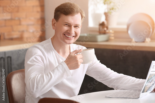 Handsome man with newspaper...