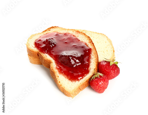 Bread with tasty strawberry jam on white background