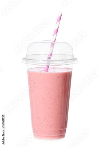 Cup of tasty strawberry smoothie on white background