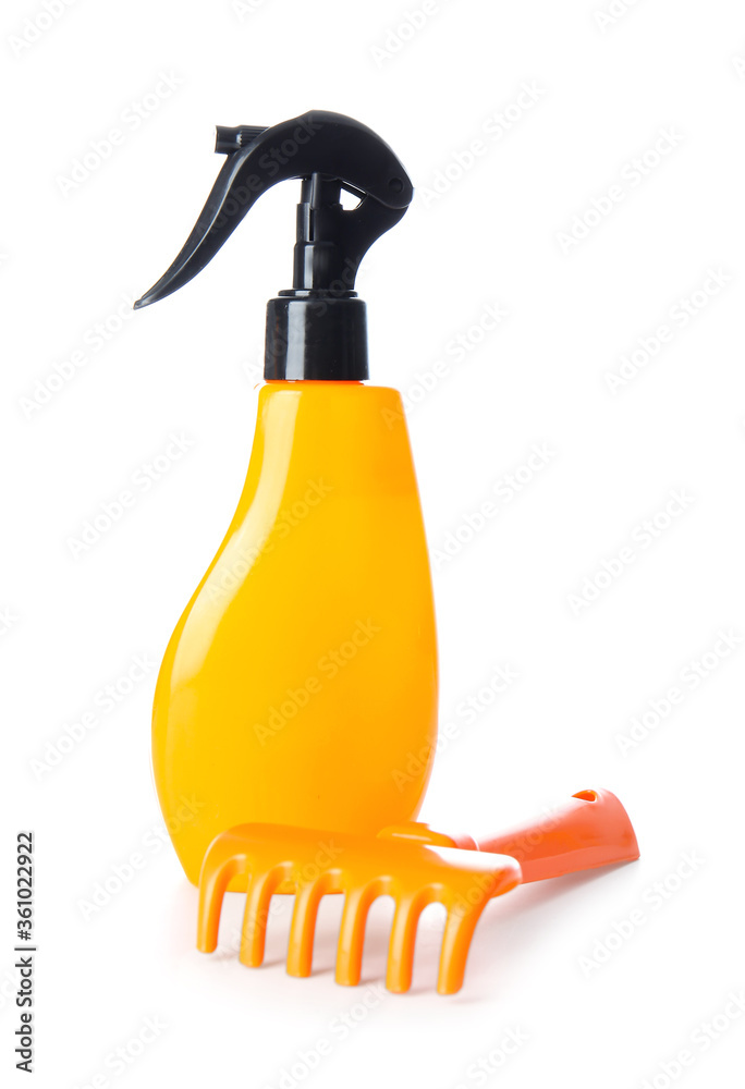 Sunscreen cream with beach toy on white background Sunscreen cream with beach toy on white background