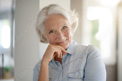 Portrait of smiling senior woman with white hair