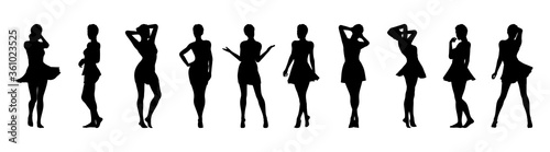 Set of beautiful a fashion girls in short dress. Silhouette of young woman. Vector illustration. photo