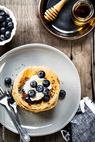 Banana Oat Pancakes with Blueberries, Coconut cream and Chia topping