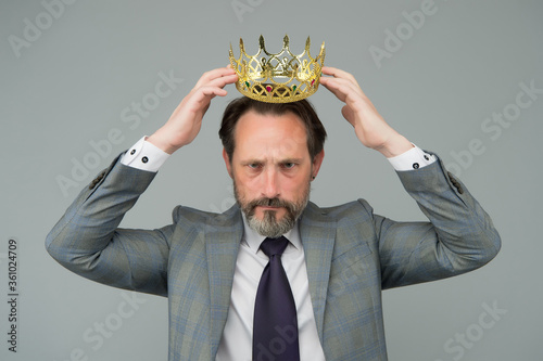 Kill your pride before you lose your head. Big boss wear crown with pride. Proud businessman grey background. Bearded man in formalwear. Pride and egoism. Pride and ambitions. Toxic ego