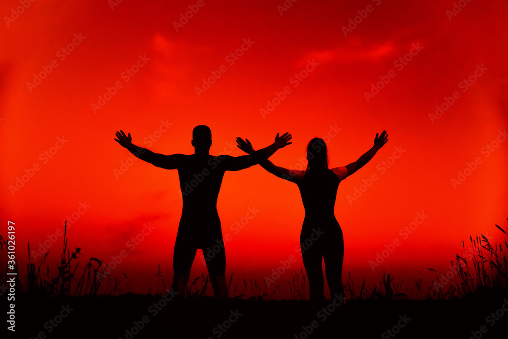 sporty couple together do sports training and yoga meditation in nature sporty couple together do sports training and yoga meditation in nature