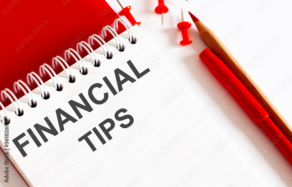 FINANCIAL TIPS .Office red tools. Digital technology. Innovative implementation in business. Wireless function.Office red tools on the withe background. FINANCIAL TIPS .Office red tools. Digital technology. Innovative implementation in business. Wireless function.Office red tools on the withe background.