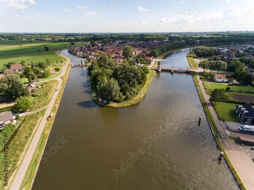 Aerial shot of Merwede and Zederik canals near the Arkel village located in the Netherlands photo