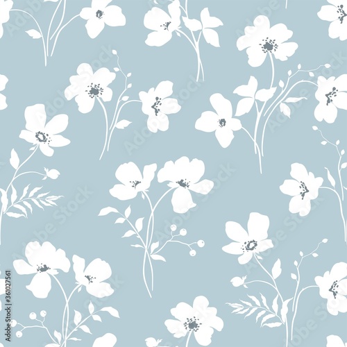 Floral seamless pattern with tender white abstract branches of flowers and leaves. Vector illustration on blue background in vintage style.