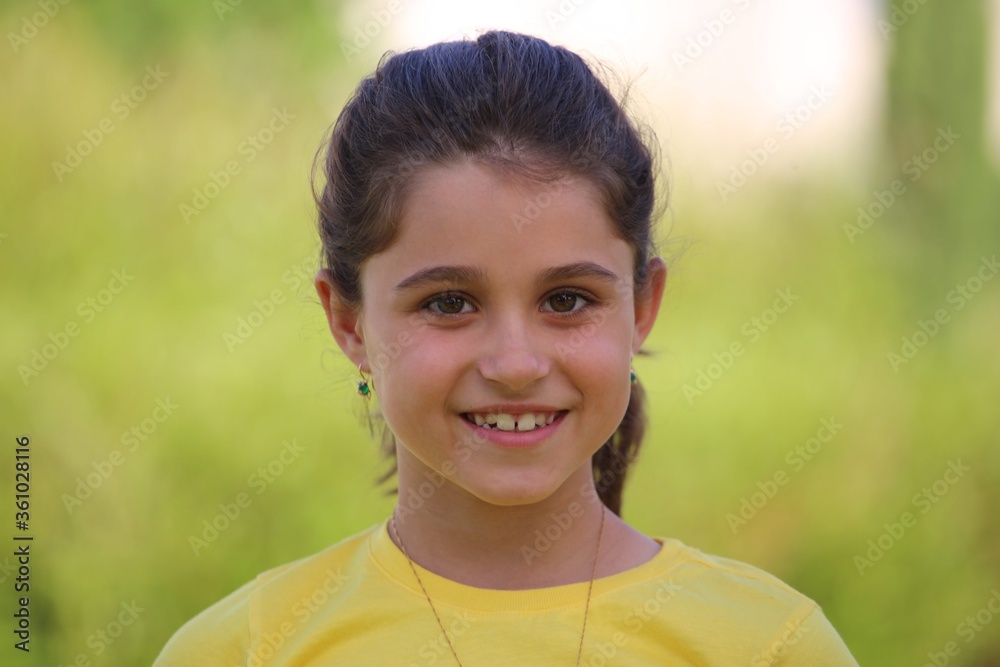 Portrait of a little girl outdoor. Motherhood, kindergarten, childhood