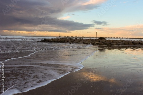 Playa de Cubelles con amanecer en la costa / Cubelles beach with a sunset in the coast photo