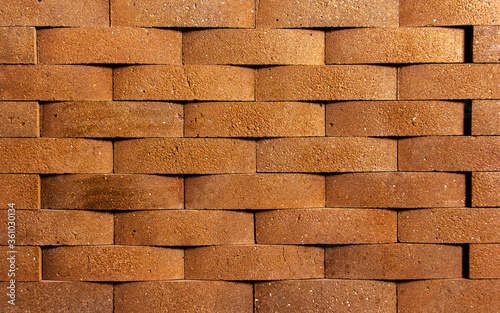 Irregular orange brick arrangement. brickwall.