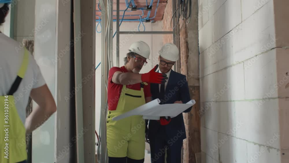 custom made wallpaper toronto digitalForeman shows house design plans to businessman at construction site