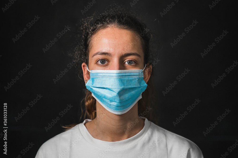 Woman with a mask. New normal. Teenager in a shopping mall with a mask. Coronavirus. Teenager wearing protection face mask against coronavirus. Woman with a mask. New normal. Teenager in a shopping mall with a mask. Coronavirus. Teenager wearing protection face mask against coronavirus.