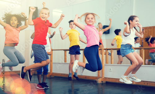 Boys and girls jumping in dance studio