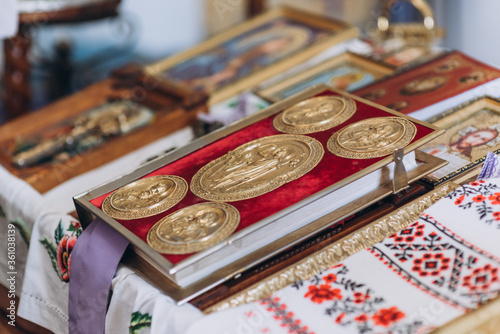 Orthodox wedding crowns, church icons, church books, gospel on the table