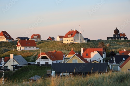 Picturesque scene of white houses on the hill in Lonstrup, Denmark photo