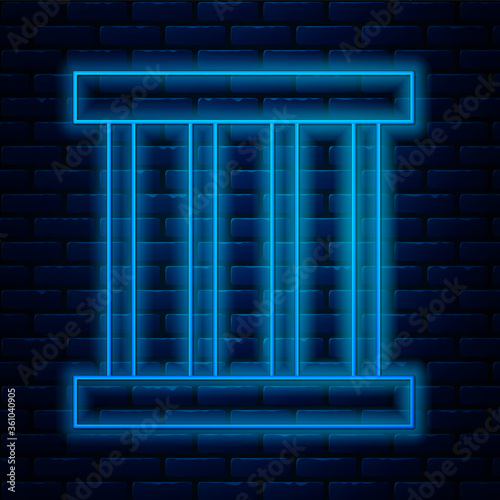 Glowing neon line Prison window icon isolated on brick wall background. Vector Illustration.