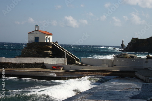 Waves at the small harbour in front of the Chapel of Panagia Thalassini at Andros, Greece  photo