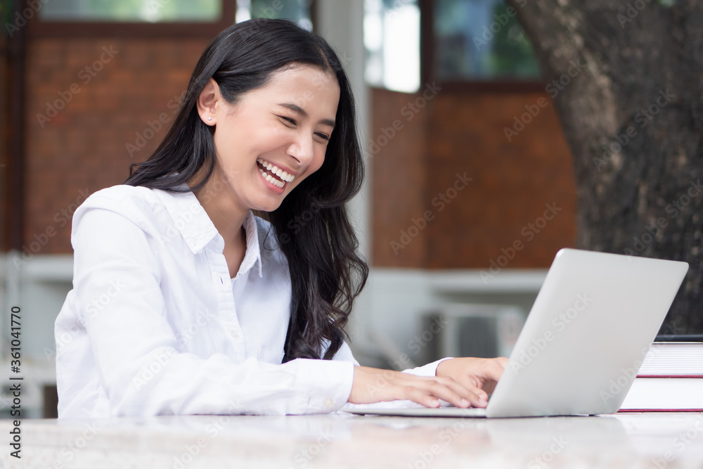 happy laughing Indian asian woman study from home with computer; concept of distance learning, online course, telelearning, internet work or study, social distancing, physical distancing, new normal