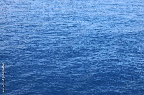 lovely blue uniform sea background with water without boats