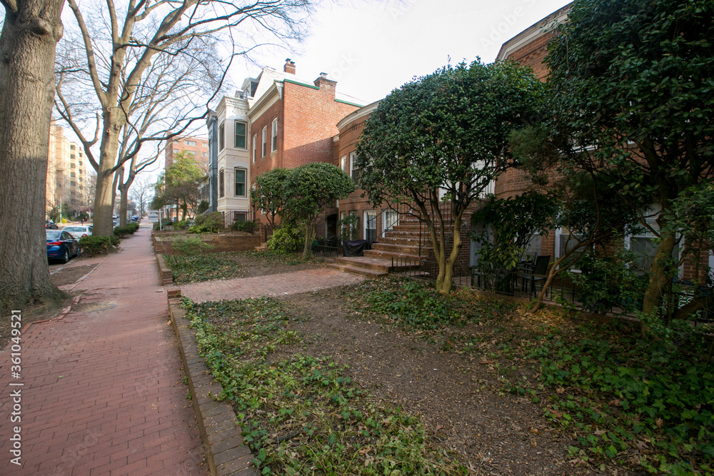 Spring, 2016 - Washington DC, USA - Residential Real Estate. Cozy beautiful townhouses in the center of the capital of America among the trees and shrubs.