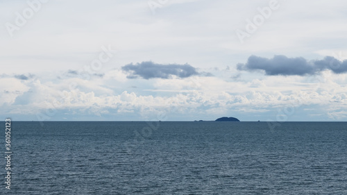 Landscape image of blue sea and cloudy sky background