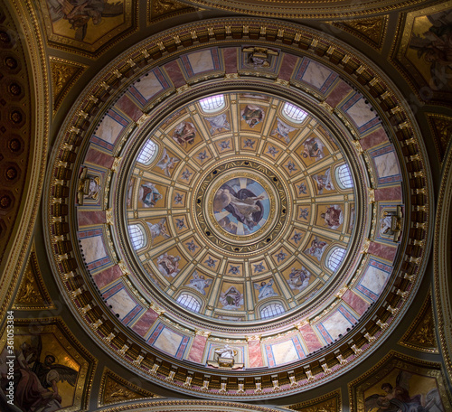 Dome of Catholic Cathedral inside with painting mural and frescoes, Budapest.