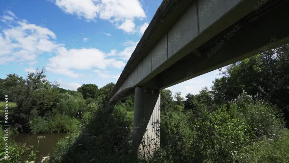 A concrete river bridge in a rural area A concrete river bridge in a rural area
