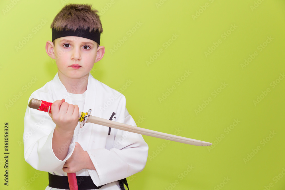 Little boy as a karate fighter. Funny faces.