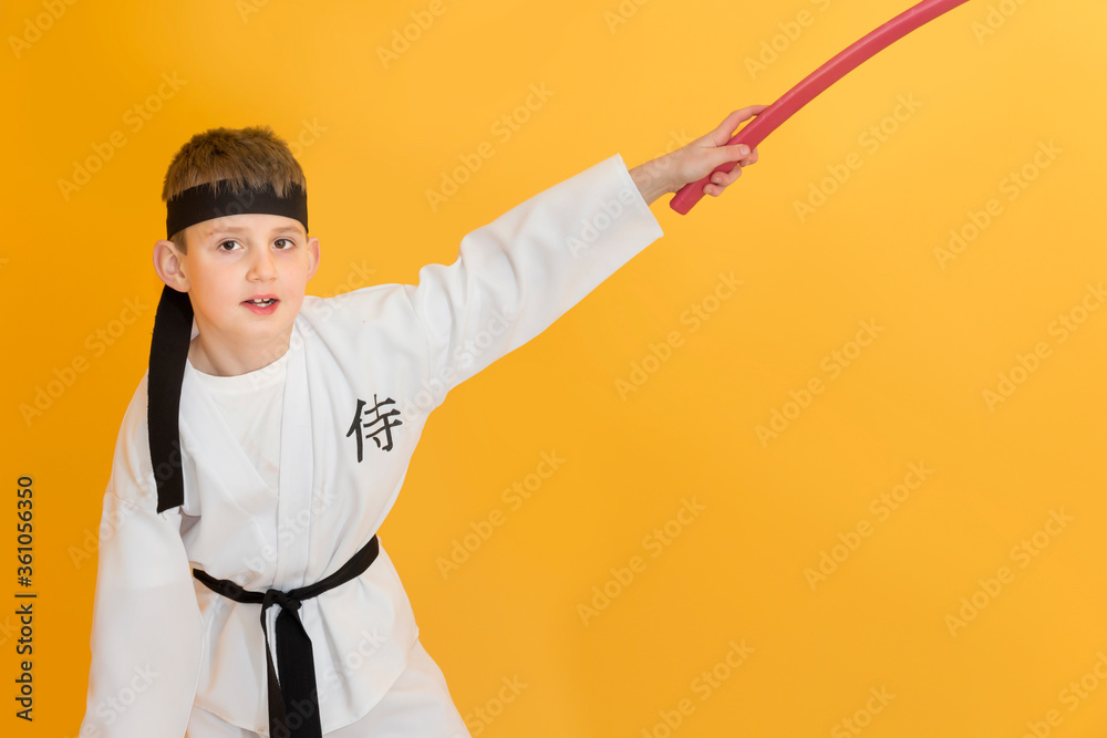 Little boy as a karate fighter. Funny faces.