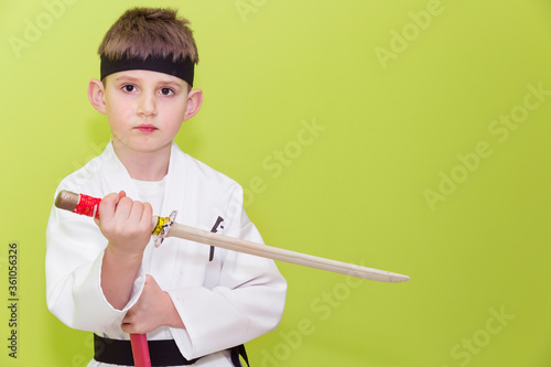 Obraz na płótnie Little boy as a karate fighter. Funny faces. w salonie