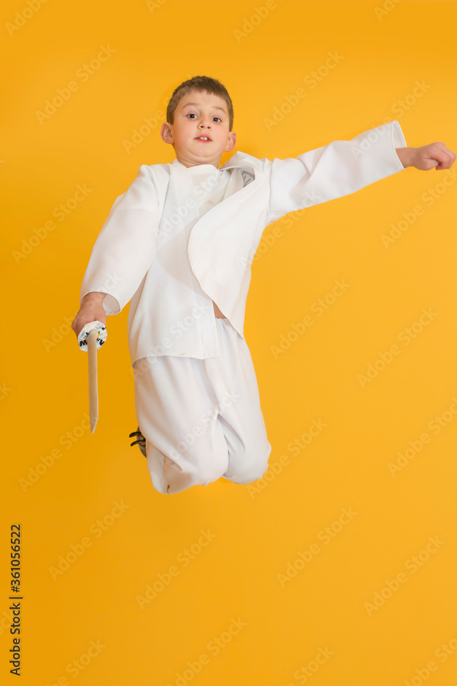 Little boy as a karate fighter. Funny faces.