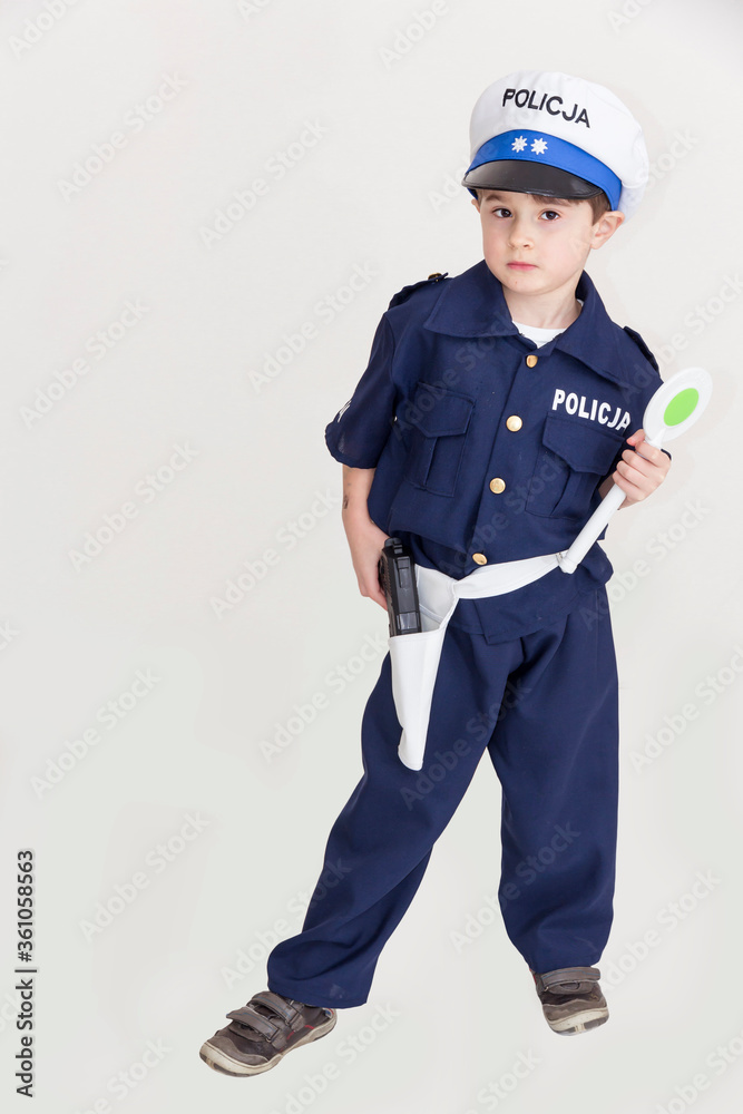 Boy age 6 boy pretending to be a police officer.
