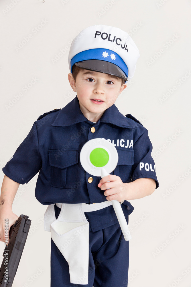 Boy age 6 boy pretending to be a police officer.