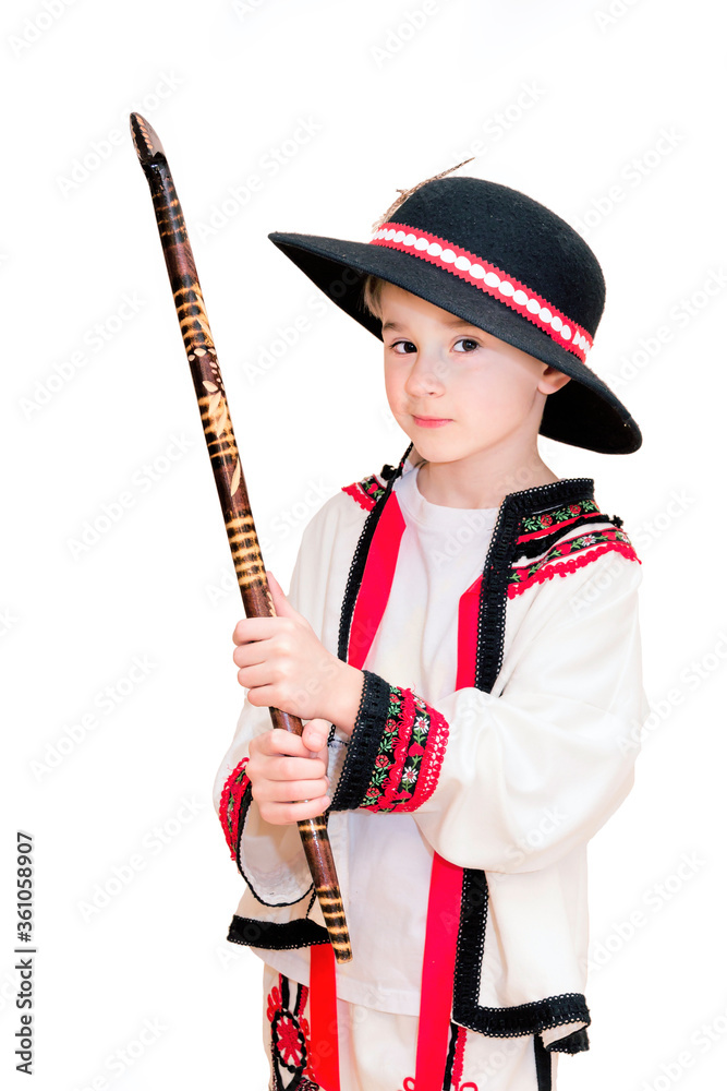 Boy age 6 boy in costume of highlander. Funny faces.