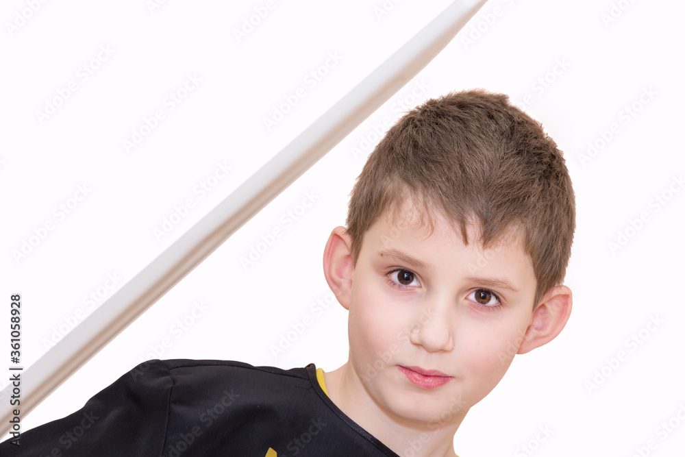 Boy age 8 fighting like karate player - black ninja.