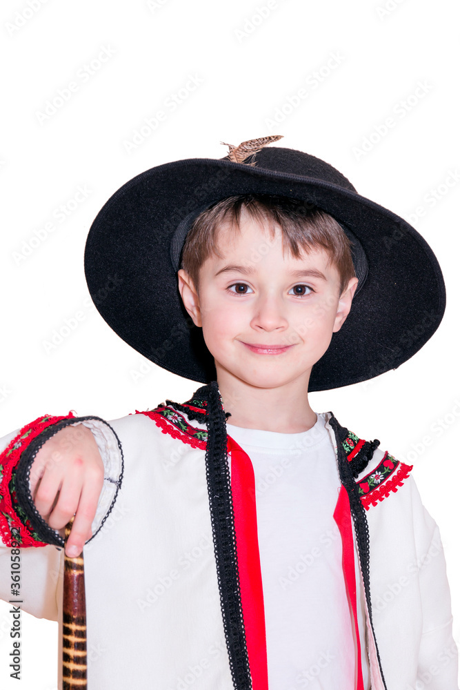 Boy age 6 boy in costume of highlander. Funny faces.