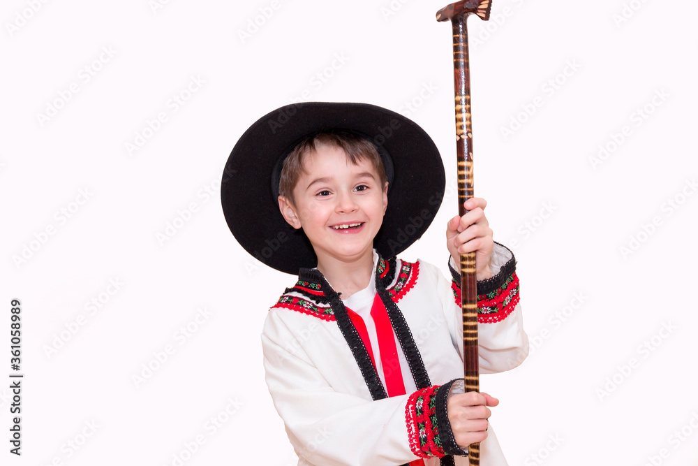 Boy age 6 boy in costume of highlander. Funny faces.