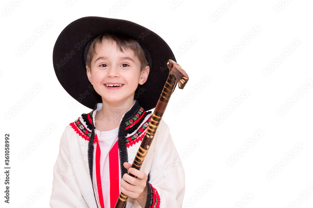 Boy age 6 boy in costume of highlander. Funny faces.