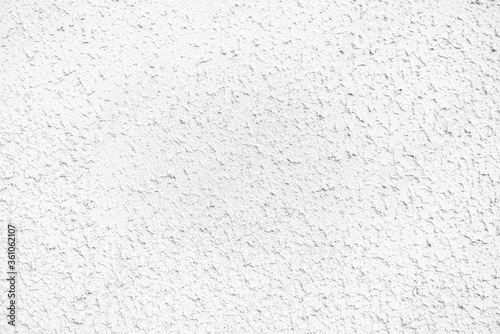 Painted white rough cement wall texture.