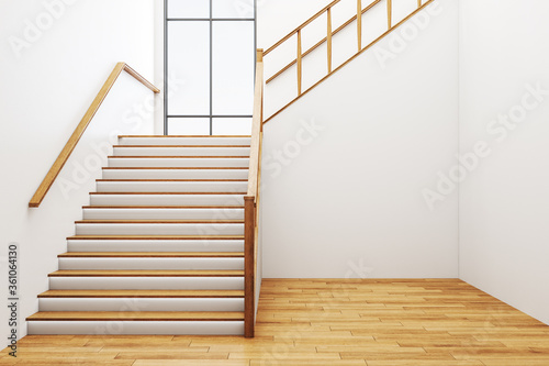 Minimalistic concrete hall interior with stairs, wooden floor and window.