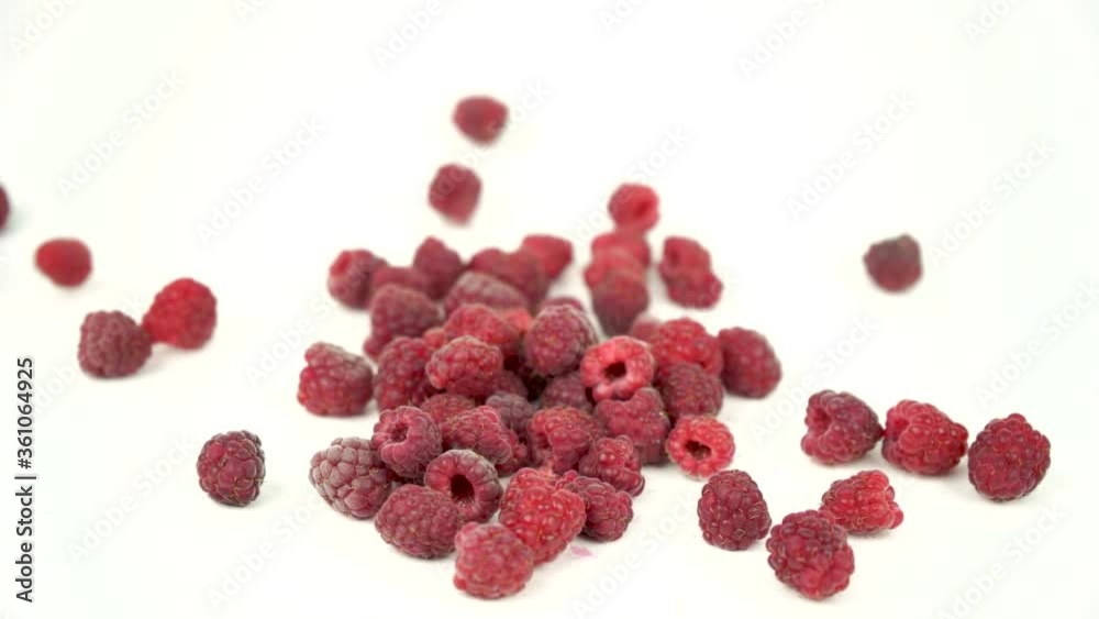 red ripe raspberry fall on white background, set of raspberries on white, slow motion footage red ripe raspberry fall on white background, set of raspberries on white, slow motion footage