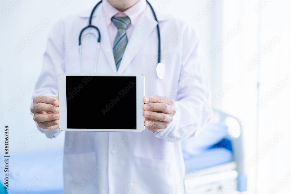 Doctor hold digital tablet with blank screen in hospital Doctor hold digital tablet with blank screen in hospital