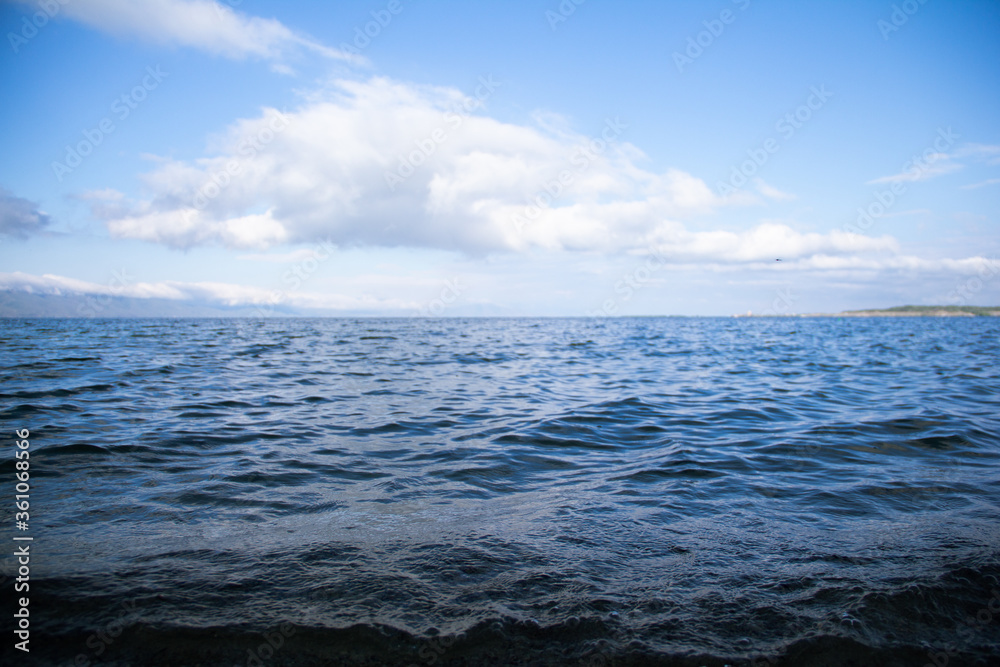 
Sea waves against the sky and clouds