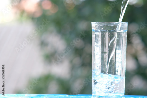 glass of water with blue background