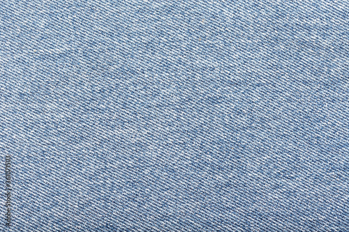 Tablou canvas Light blue denim fabric background. Close up
