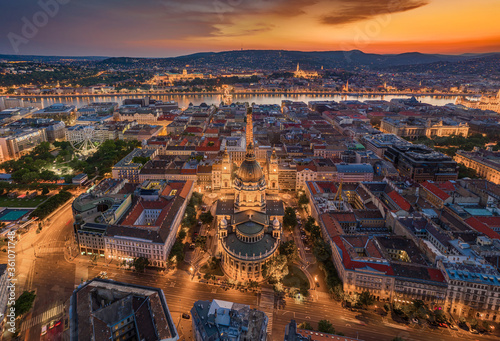 Budapest, Hungary - Aerial panoramic view of illuminated Budapest with a magnificent golden sunset. The view includes St.Stephen's Basilica, Szechenyi Chain Bridge and ferris wheel at Elisabeth Square