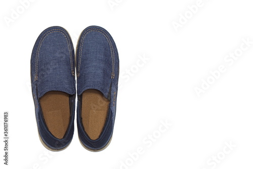 Blue slip-on casual male shoes over white background. Isolated on white. Use for catalogues, online shops, web sites, advertising booklet, poster. Top wiew. With copy space for text.
